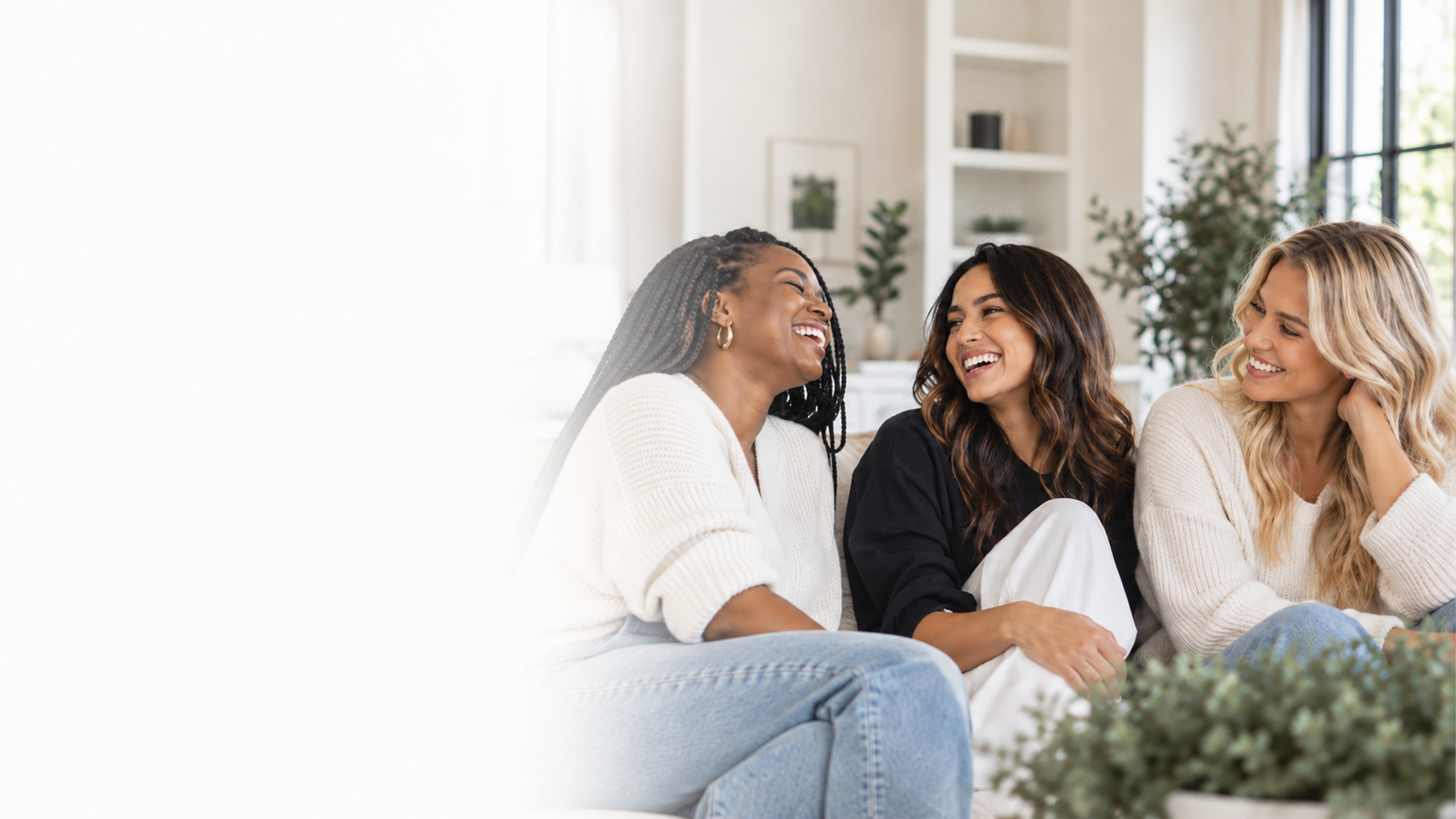 Three women sharing a joyful conversation together
